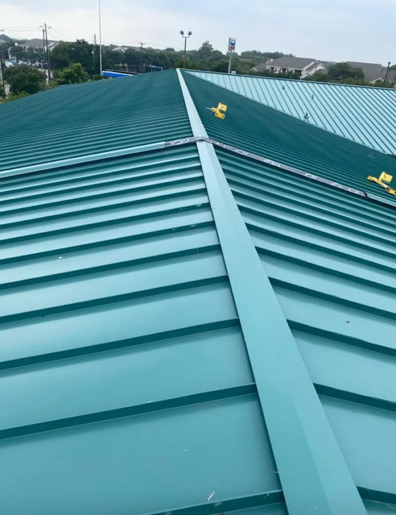 Green commercial metal roof ridge and valley for Metal Roof Repair in Evanston