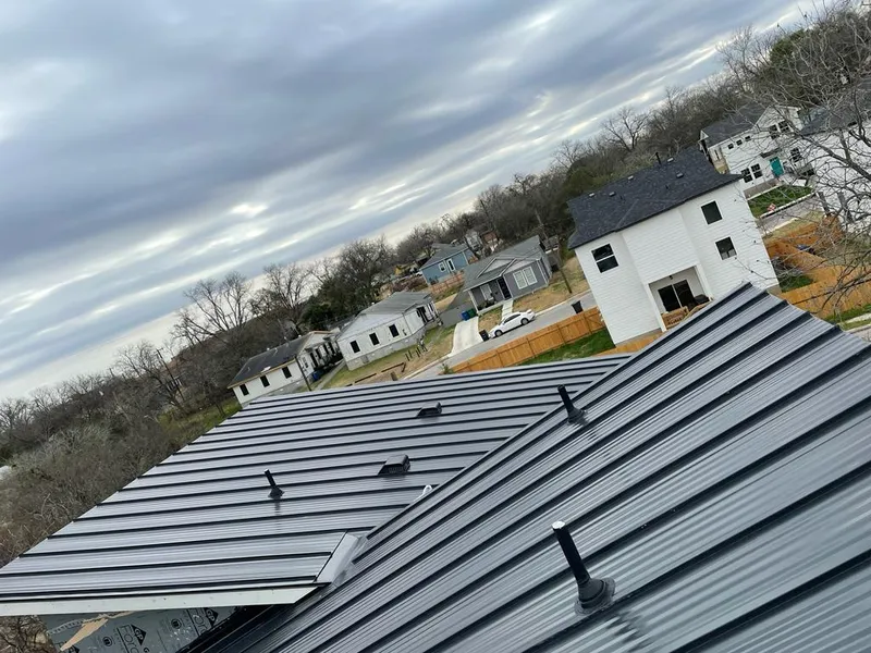 Standing seam metal roof panels with vents for Skylight Repair in Evanston
